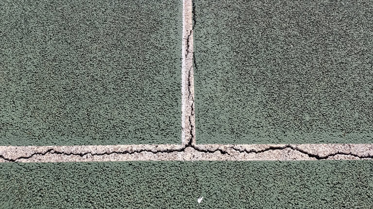 Why Do the White Lines on My Court Keep Cracking?